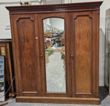 Edwardian James Shoolbred & Co mahogany three-door wardrobe with central mirror door, two door