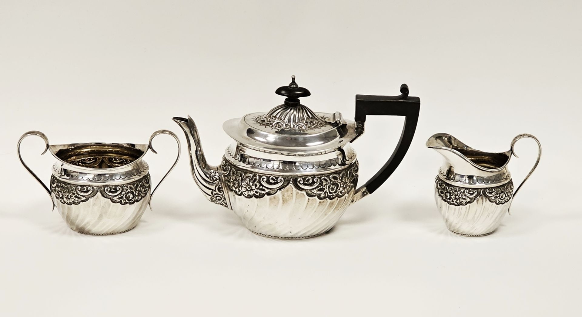 Victorian silver three-piece bachelor's teaset by Sibray Hall & Co, London 1893-1894, comprising