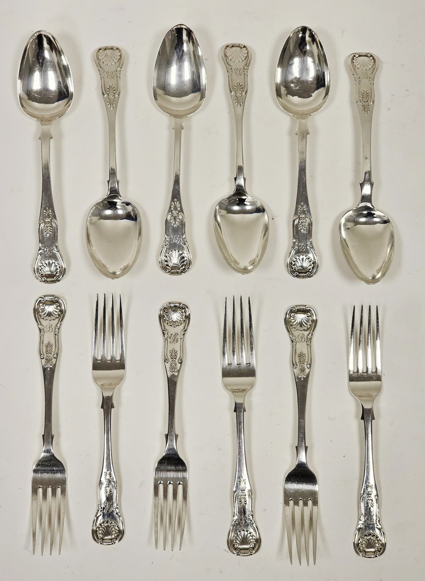 Matched set of six pairs of Victorian Scottish silver dessert spoons and forks, kings pattern, all
