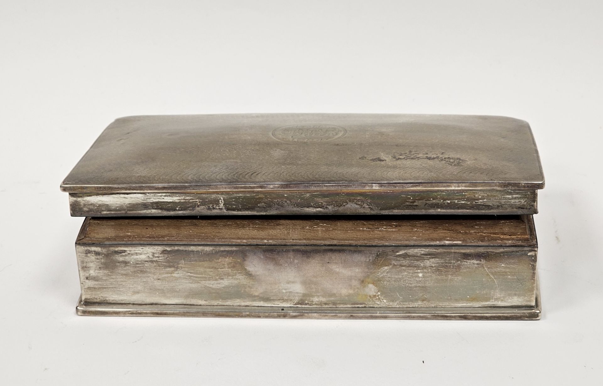 Early 20th century silver cigarette box of rectangular form, the lid with engine-turned