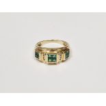 14ct gold, emerald and diamond dress ring having three squares each of four square-cut emeralds