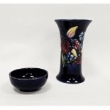 Moorcroft blue-ground Iris pattern flared cylindrical vase and a small blue trinket dish, printed