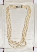 Triple string of graduated cultured pearls with white 9ct gold and pearl clasp, in Falconer's Hong