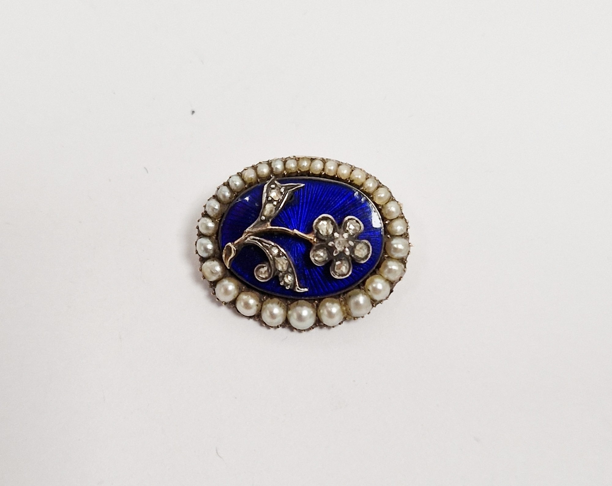 Victorian enamel, diamond and pearl mourning brooch, oval, the blue enamel with old cut diamond