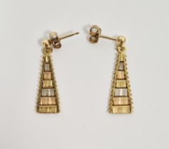 Pair 18ct tricolour gold earrings, the tapered pendant drop with bands of matt three-colour gold, 4g