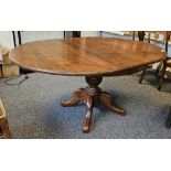 20th century stained hardwood extending dining table of circular form, raised on four cabriole legs,