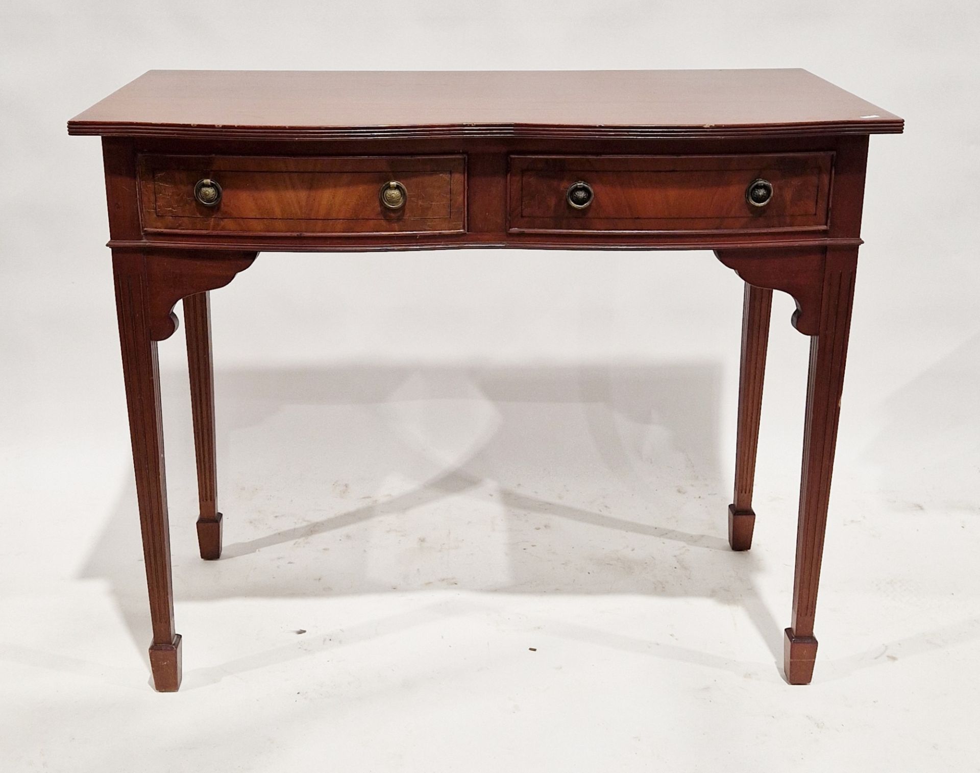 20th century mahogany serpentine fronted console table with two short drawers to the front, on
