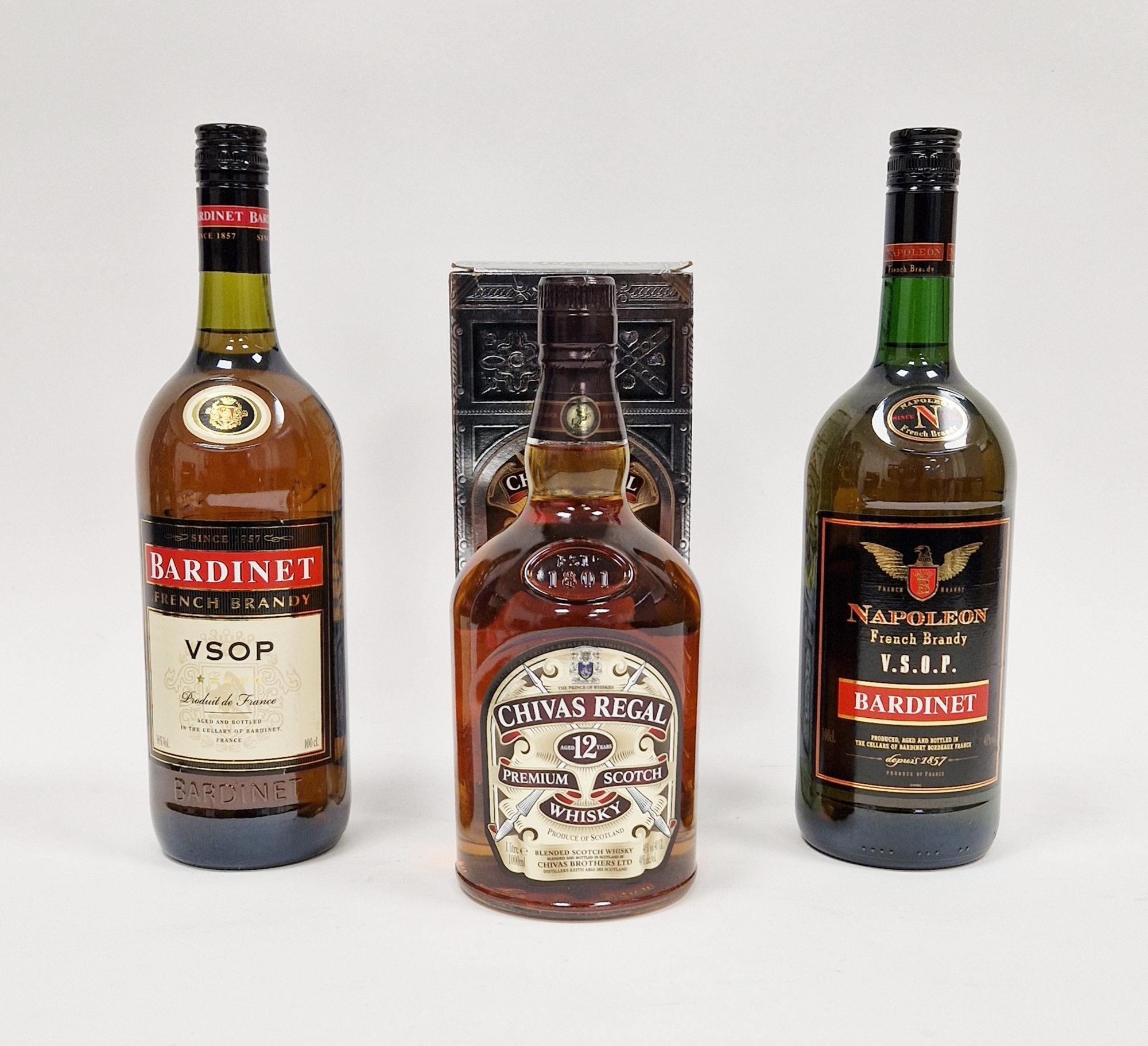 Two 1 litre bottles of Bardinet VSOP French brandy and a 1 litre of Chivas Regal 12 year old in