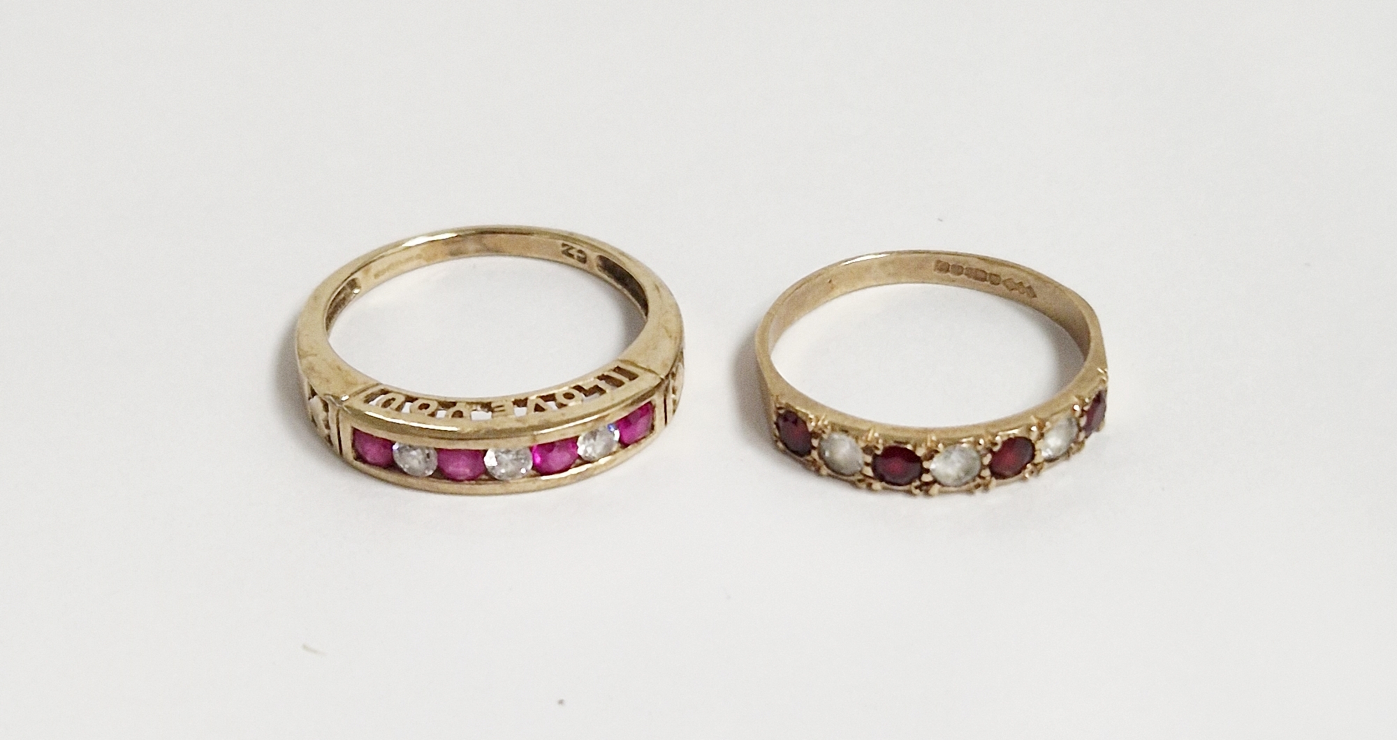 9ct gold, cubic zirconia and pink stone ring, half-eternity style, set three white stones and four