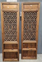 Two Chinese late 19th/early 20th century pierced wooden panels, each of rectangular form, recessed