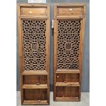 Two Chinese late 19th/early 20th century pierced wooden panels, each of rectangular form, recessed