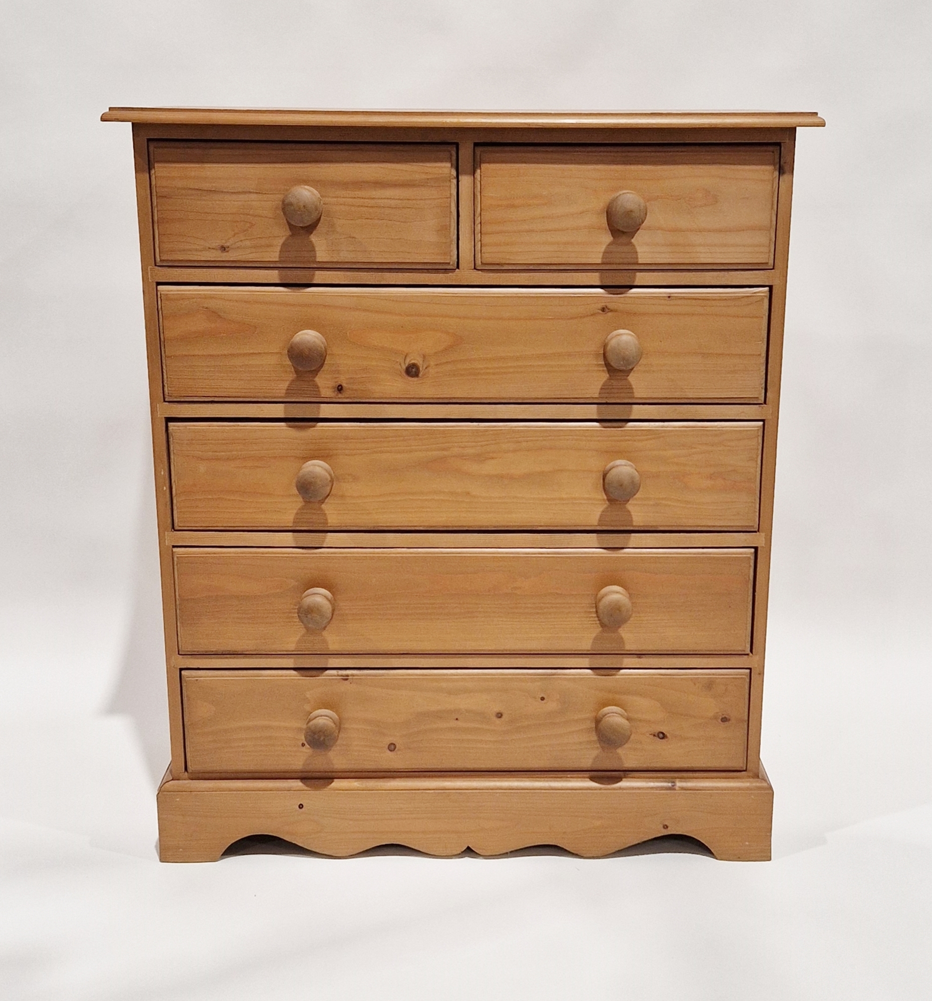 Modern pine chest of two short over four long drawers, each with turned handles, 112cm high x 88cm