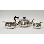 George V three-piece silver teaset comprising teapot, twin-handled sugar bowl and milk jug,