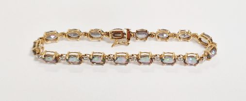 14K gold, diamond and 'mystic' topaz bracelet set oval-coloured stones and small diamonds in