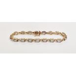 14K gold, diamond and 'mystic' topaz bracelet set oval-coloured stones and small diamonds in
