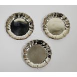 Set of three Danish silver coasters circular with raised triple-reeded ogee borders, 9.5cm diameter,