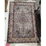 Persian style cream ground rug with central floral medallion on floral field and floral spandrels,