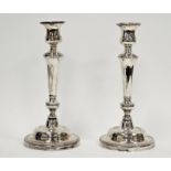 Pair white metal candlesticks, unmarked, each with bell-shaped sconce, shouldered tapering column,