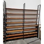 Mid century Ladderax three-section shelving unit comprising three black painted metal frames and