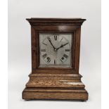 Oak cased four-glass mantel clock of rectangular form, on stepped moulded base, a 15cm square dial