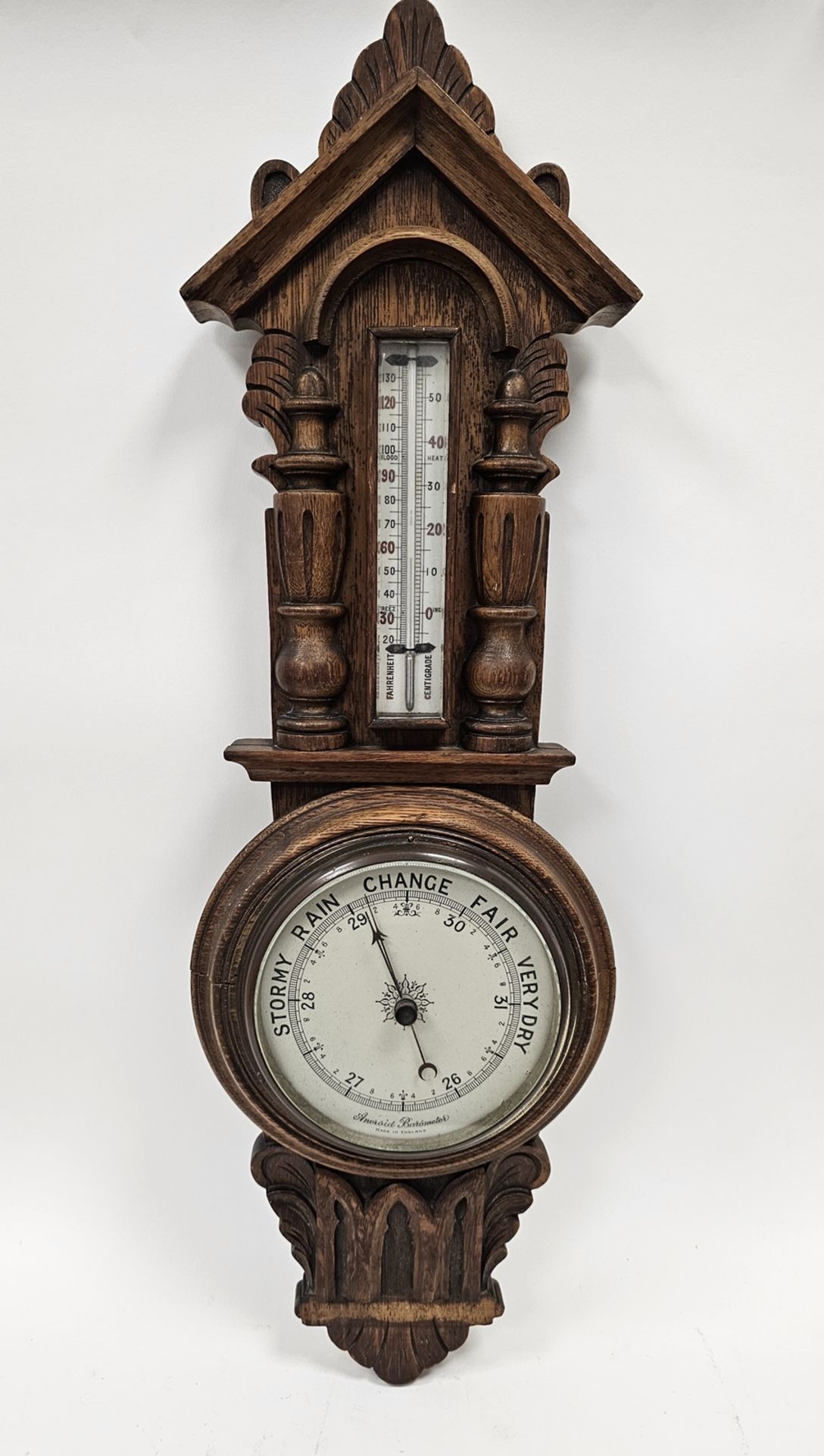 19th century oak cased elaborately carved banjo barometer marked 'Aneroid Barometer, Made in