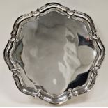 Silver salver by Atkin Brothers, Sheffield 1934 of shaped circular form with undulating border, on