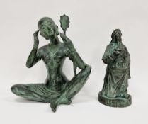 Patinated metal figure of an Eastern girl sitting cross-legged, holding up a mirror while she does