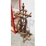 20th century spinning wheel, probably beech, on baluster tripod supports, 87.5cm high