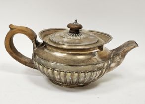 George III silver teapot, possibly by Henry Nutting, London 1811, of half fluted circular form,