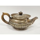 George III silver teapot, possibly by Henry Nutting, London 1811, of half fluted circular form,
