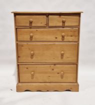 20th century pine chest of drawers having two short over long drawers, each with turned wooden