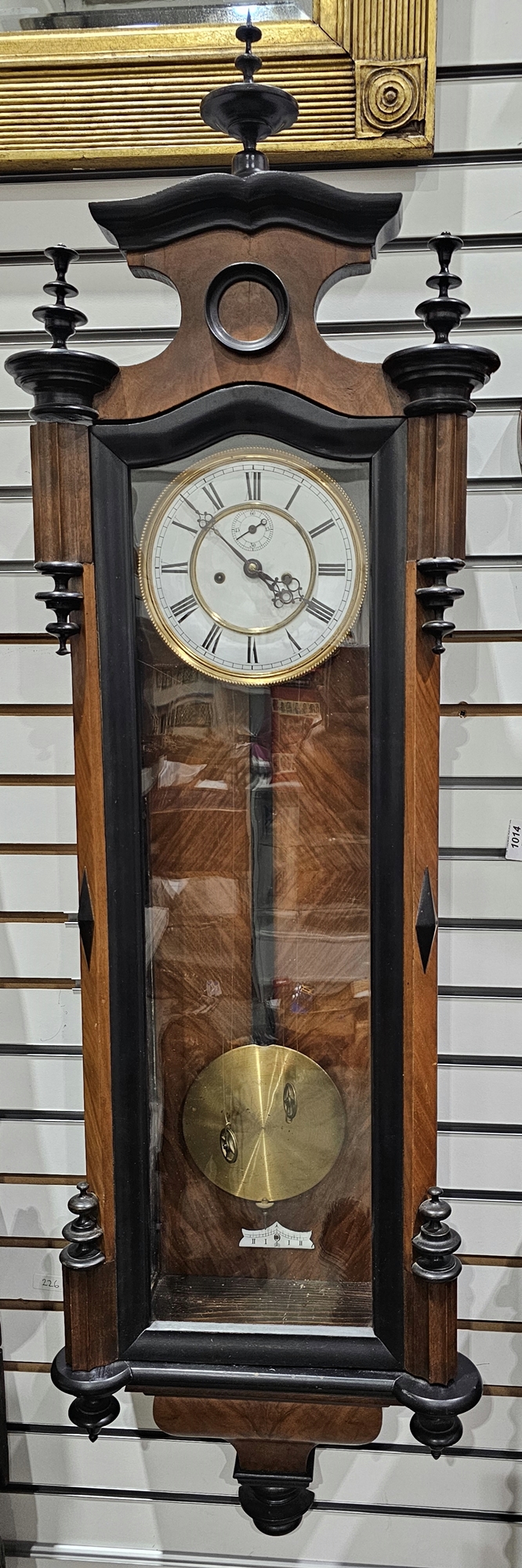 19th century Vienna-style walnut regulator clock, with a white enamel dial, with black Arabic