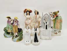 Collection of Staffordshire pottery figures including a Wesley clock face group and two further