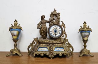 French ormolu mantel clock, the blue and white floral decorated dial on elaborately moulded base