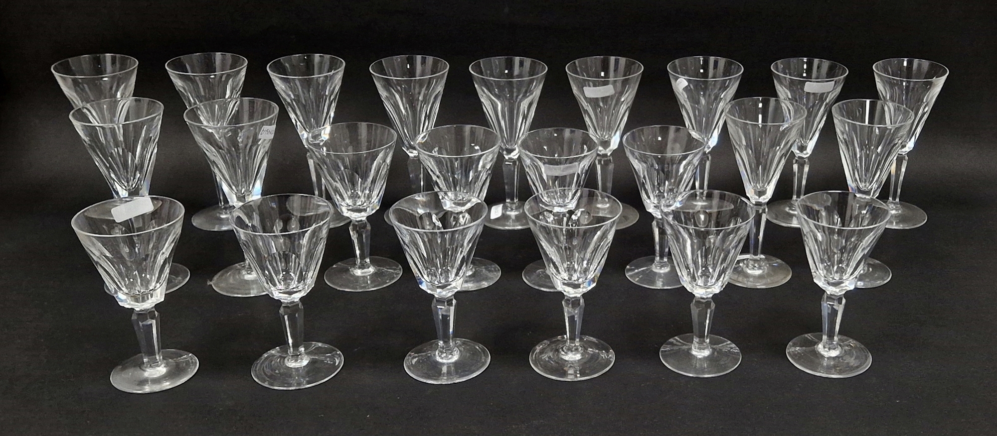 Quantity of Waterford 'Sheila' pattern wine glasses, each conical bowl panel cut, on faceted