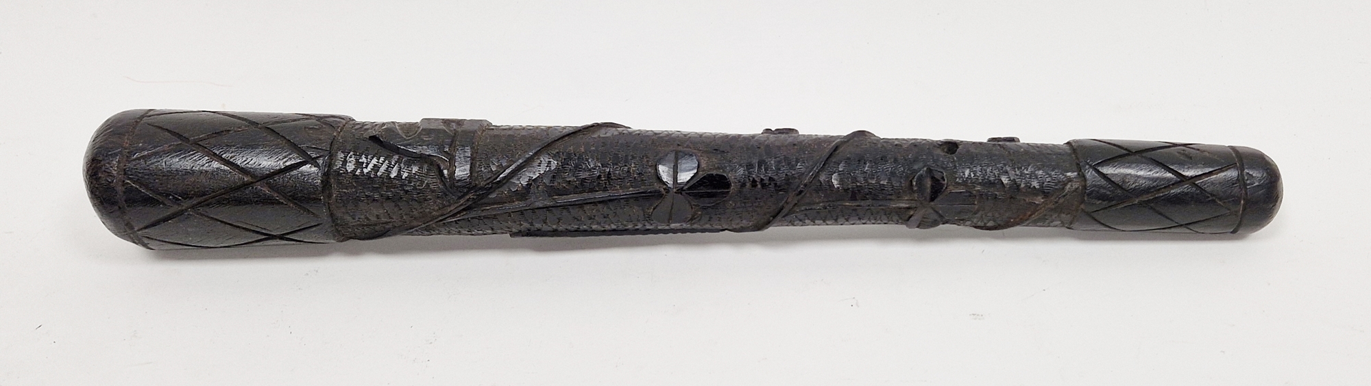 Late 19th century Irish bog oak carved salmon priest, carved with shamrocks and a harp, 43cm long