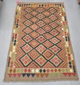 Maimana blue ground kilim,  with thre rows of seven and two rows of six lozenges to multiple