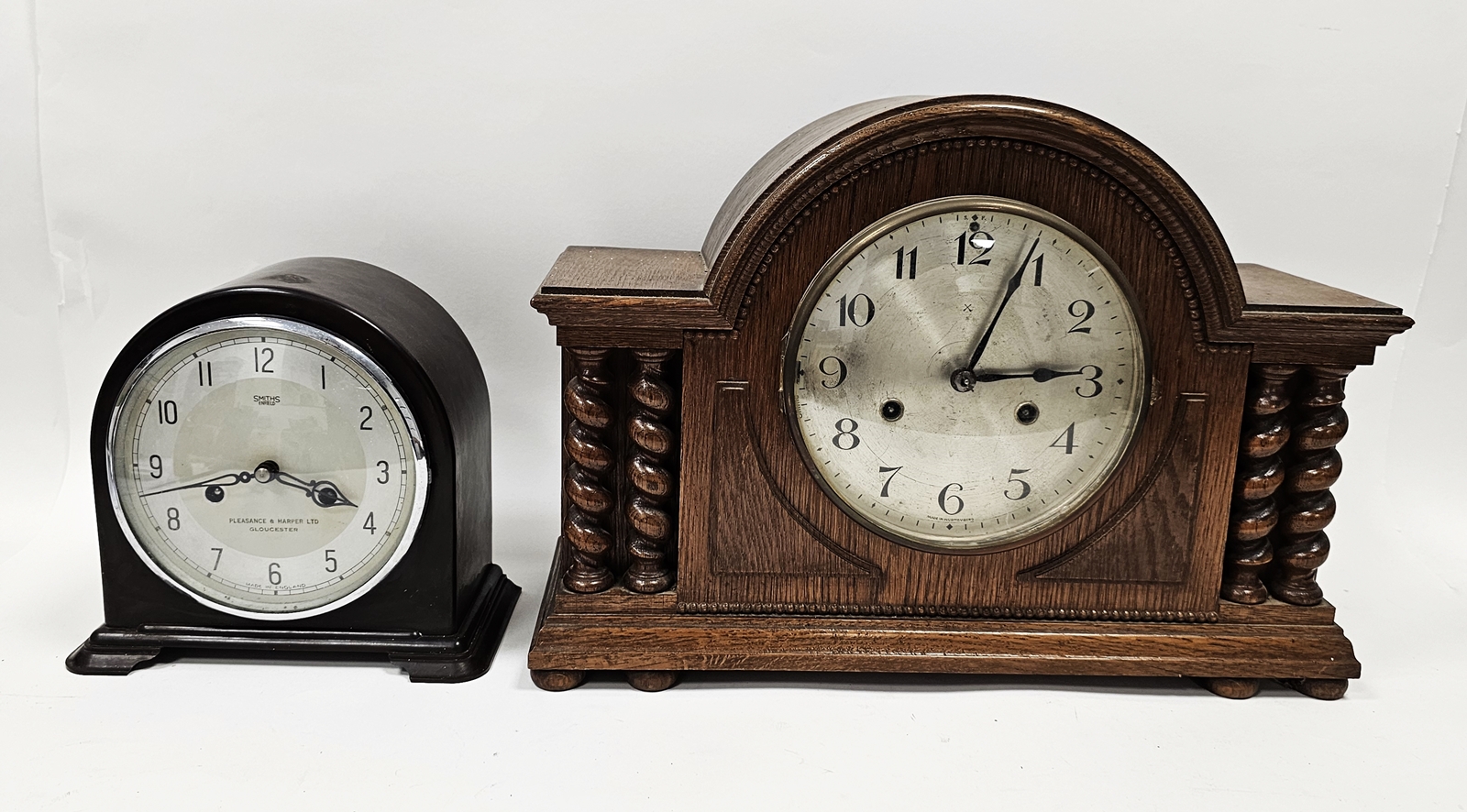Arched shaped bakelite mantel clock by Smiths, Enfield retailed by Pleasance & Harper, Gloucester,
