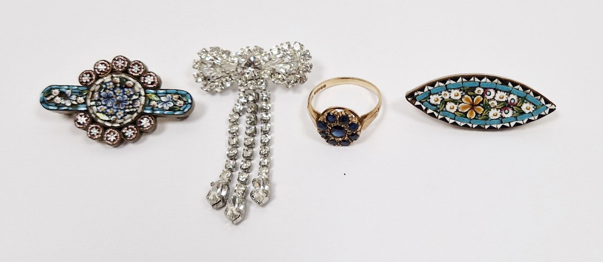 9ct gold and sapphire cluster ring, white metal and diamante bow-pattern and drop brooch and two