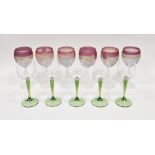A set of six frosted glass hock glasses, moulded decoration and red rims, possibly by Rueven, 18cm