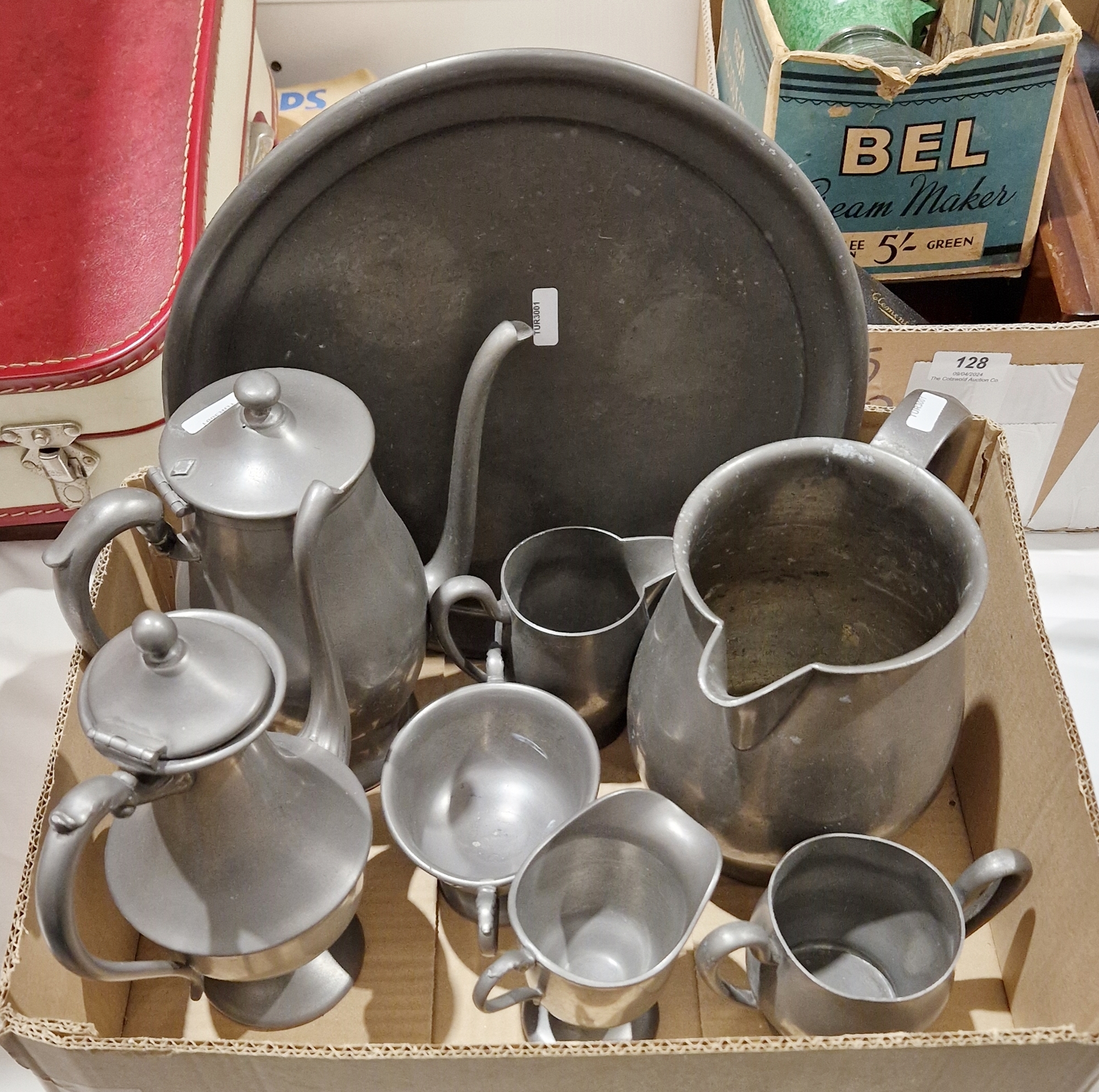 Pewter items to include chocolate pot, coffee pot, platter, jugs, etc (1 box)