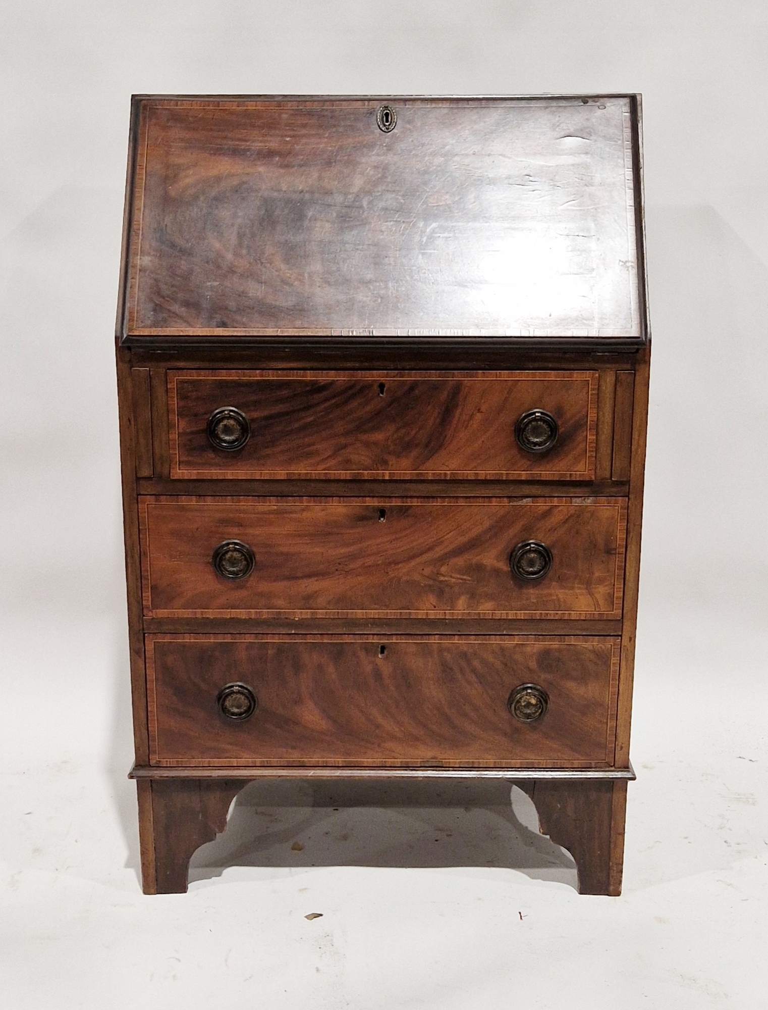 Late 19th/early 20th century mahogany bureau, the fall front opening to reveal pigeonholes and a