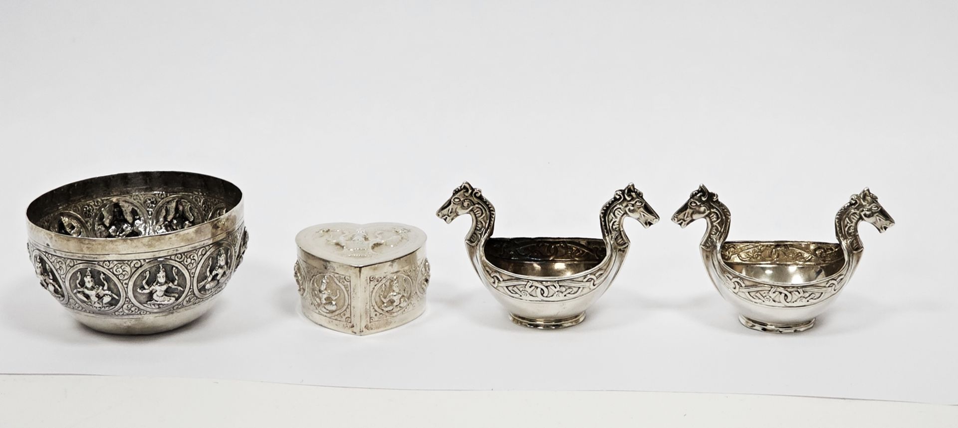 Indian white metal small sugar bowl, of circular form decorated with a band of deities, 7.5cm