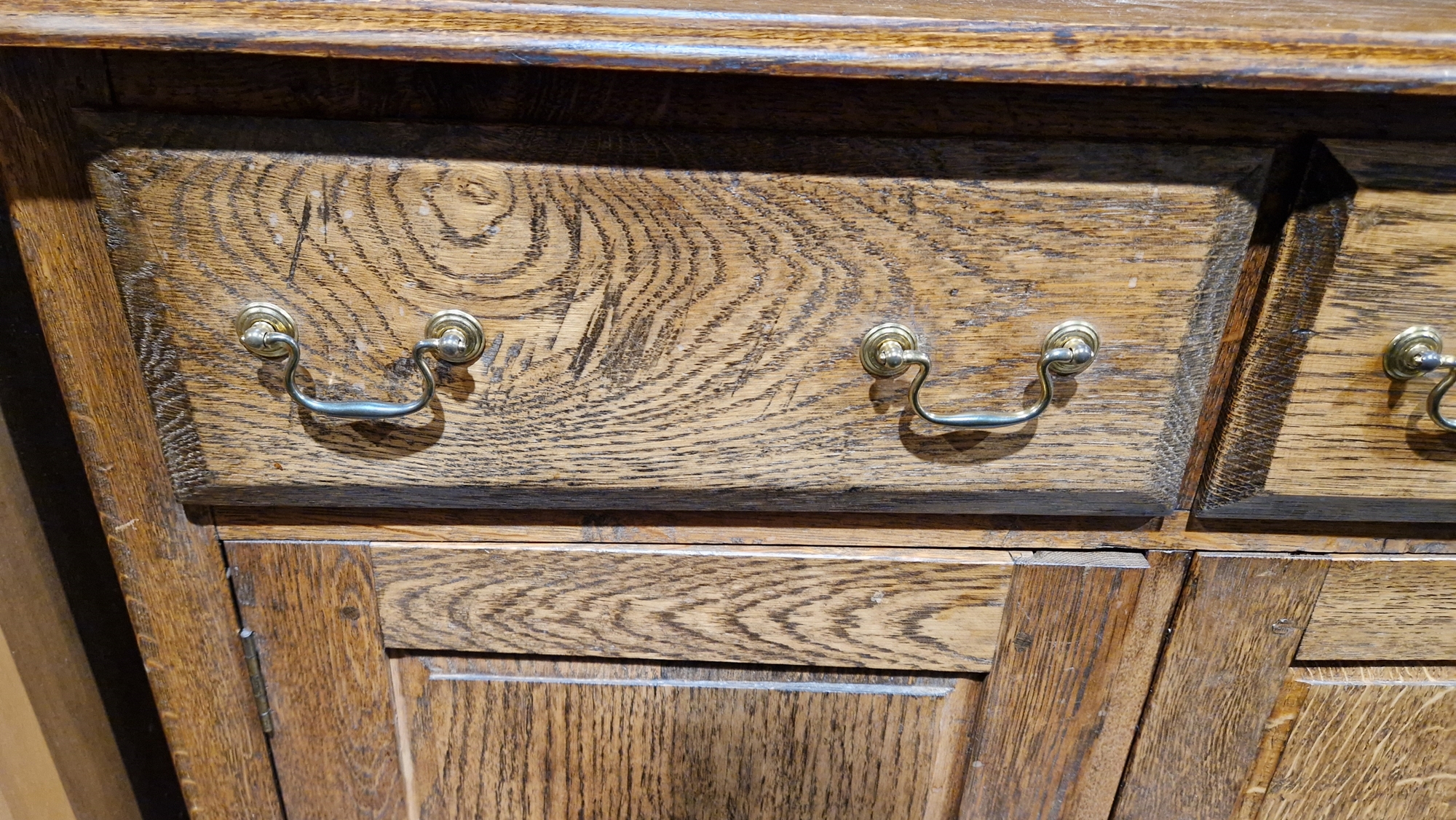 Oak Welsh dresser with two-tier platerack over two short drawers and a two-door cupboard, brass - Image 8 of 13