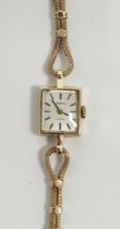 Lady's 9ct gold Tissot wristwatch with square dial, baton numerals and the fancy chain link