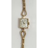 Lady's 9ct gold Tissot wristwatch with square dial, baton numerals and the fancy chain link