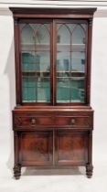 George IV mahogany secretaire bookcase enclosed by pair of glazed gothic bar doors, flanked by