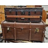 Large wood and metal bound steamer trunk, the lid opening to reveal a fitted interior, with two