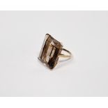 Gold-coloured metal and smoky quartz dress ring set large rectangular cut stone, the stone 25mm x