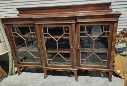Late 19th/early 20th century mahogany display cabinet/sideboard with three glazed doors containing